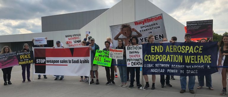 Protesters challenge Raytheon support of JFK Library Space Celebration