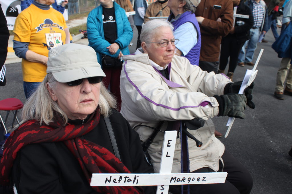 Ausra Kubiliis and Jeanne Gallo protest at the School of the Americas at Fort Benning, Georgia. Photo by Sunny Robinson, November 2019