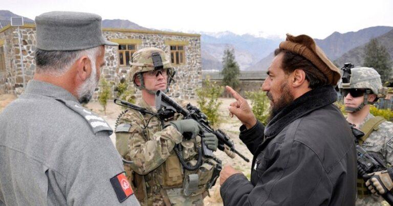 U.S. Army Captain talks with the Nurgaram district sub-governor in Nuristan, Afghanistan. Photo by Chief Master Sgt. Richard Simonsen/U.S. Air Force