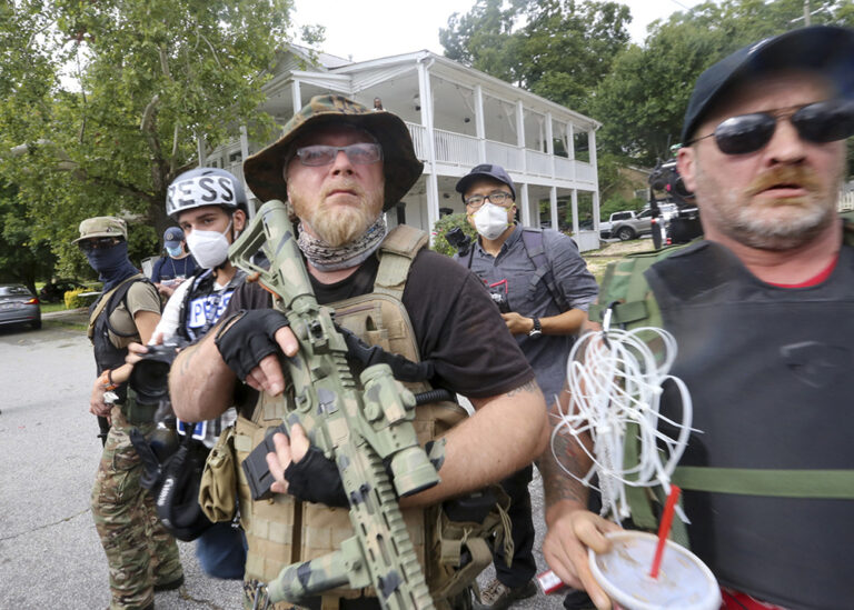 Far-right groups, including militias and white supremacists, rally Saturday, Aug. 15, 2020, in Stone Mountain, Georgia, while a broad coalition of leftist anti-racist groups organized a counter-demonstration. (Jenni Girtman/Atlanta Journal-Constitution/TNS)