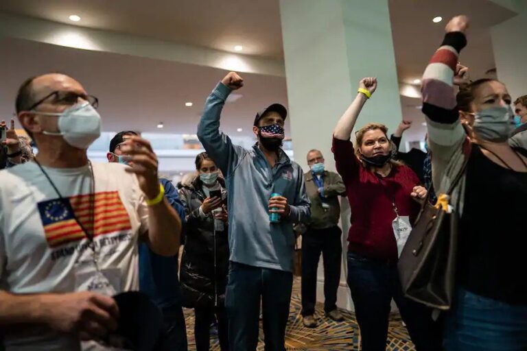 Election challengers protest and demand to enter the room where ballots were being counted in Detroit on Nov 4. (Salwan Georges/The Washington Post)