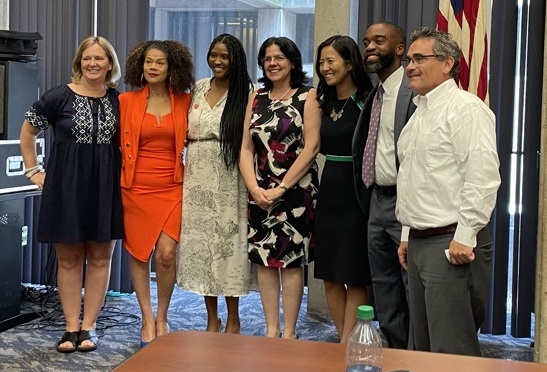 L to R; Boston City Councilors Erin Murphy, Julia Mejia, and Kendra Lara; Ambassador Torres; Mayor Michelle Wu; and Councilors Brian Worrell and Frank Baker, at City Hall on June 29. MAPA photo