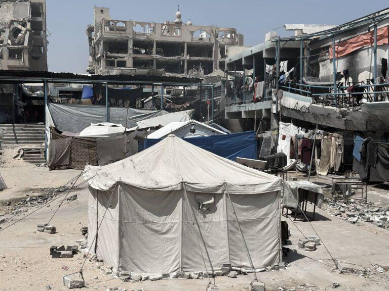 Forcibly displaced people seek shelter in a destroyed UNRWA school in Gaza City, the Gaza Strip, June 2025. © 2025 UNRWA photo