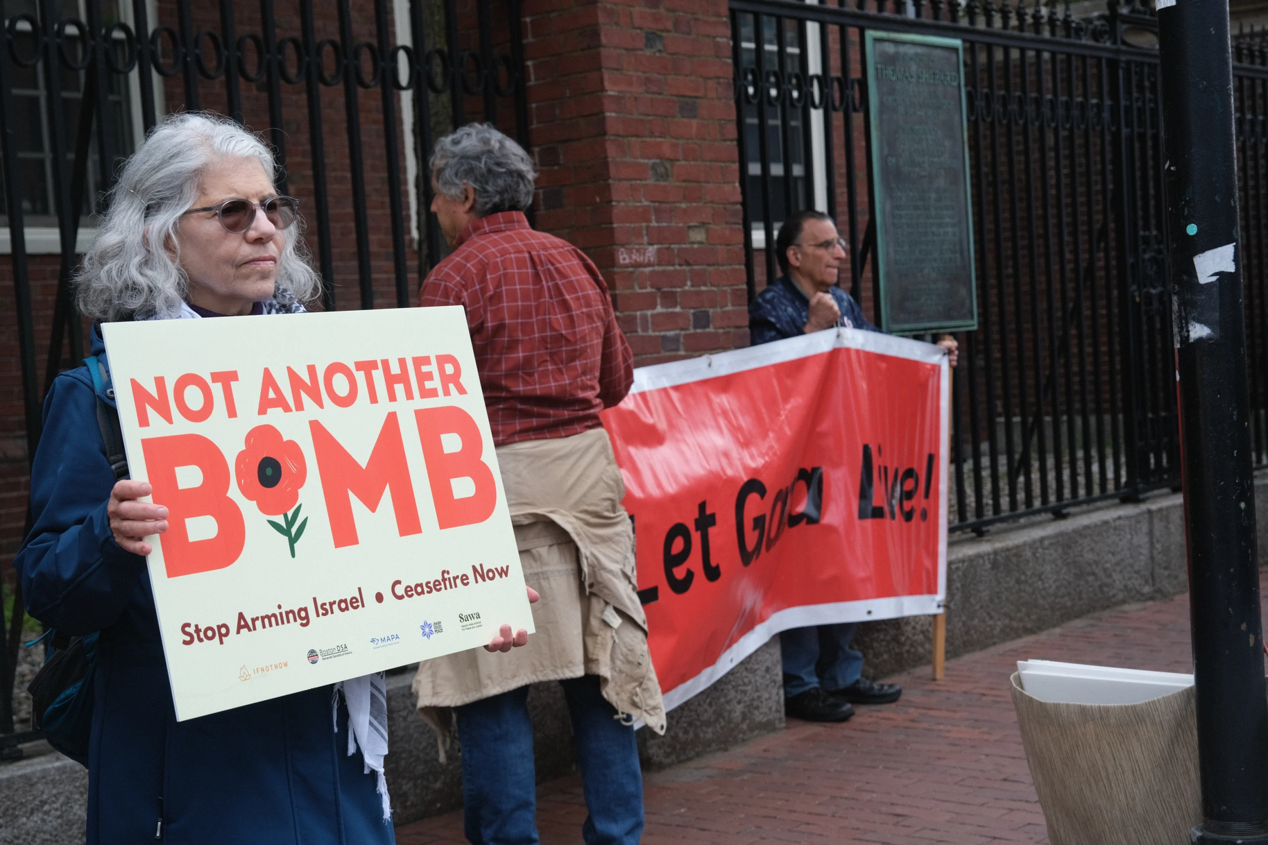 A MAPA supporter using campaign materials at a public action